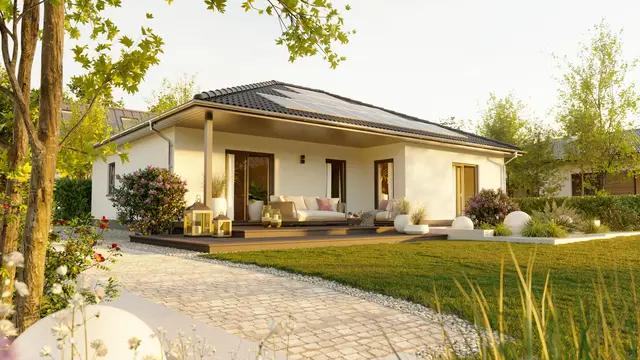 Ein stilvoller, eingeschossiger Winkelbungalow in L-Form mit geschützter Terrasse, bodentiefen Fenstern und großzügigem Grundriss
